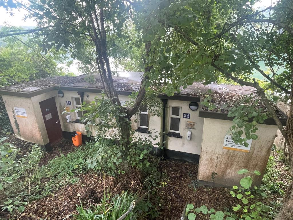 Lot: 104 - FORMER PUBLIC CONVENIENCES WITH FANTASTIC RIVER FAL VIEWS - Front elevation of detached toilet block